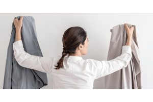 woman holding bedsheets