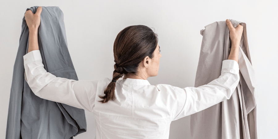 woman holding bedsheets