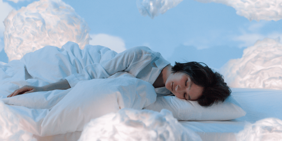 Woman sleeping in the clouds